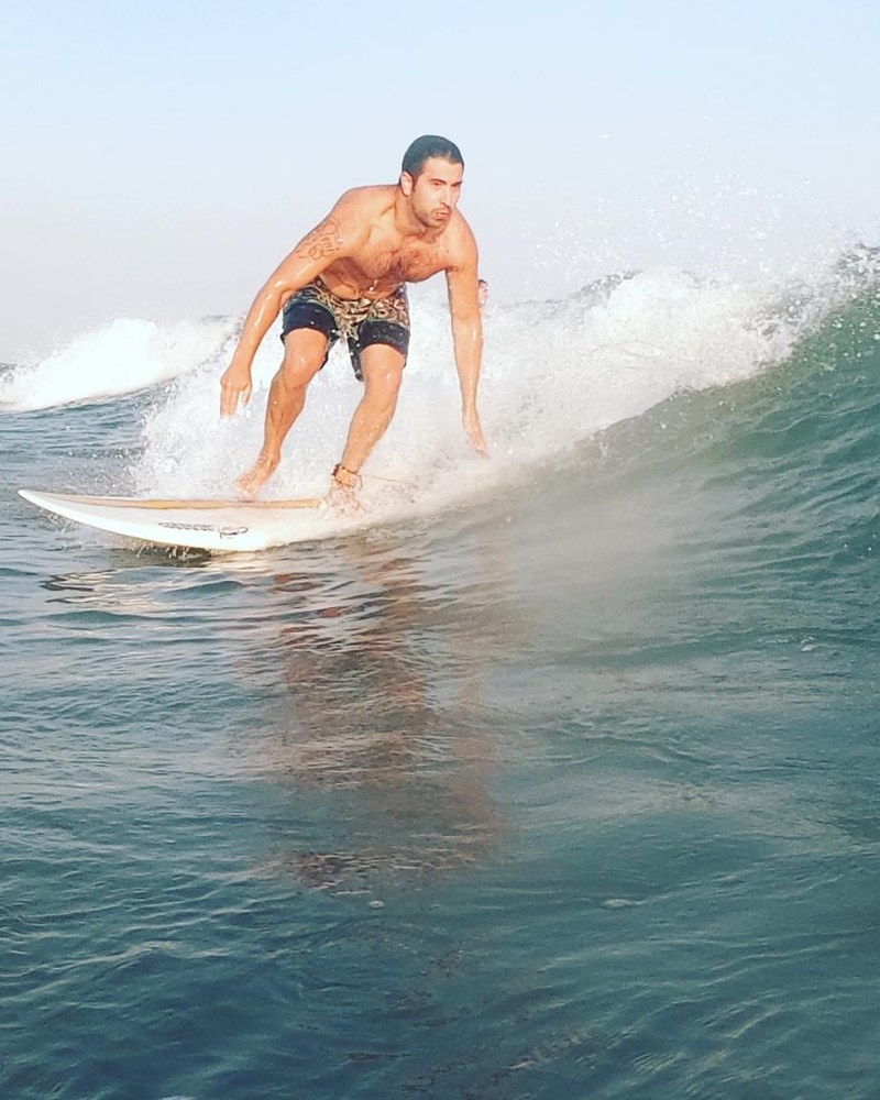 Juani surfing a wave